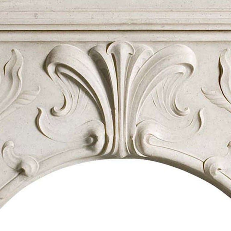 Marble fireplace with Art Nouveau stylistics. Floral decorations and a round hearth. Made in France around 1900.