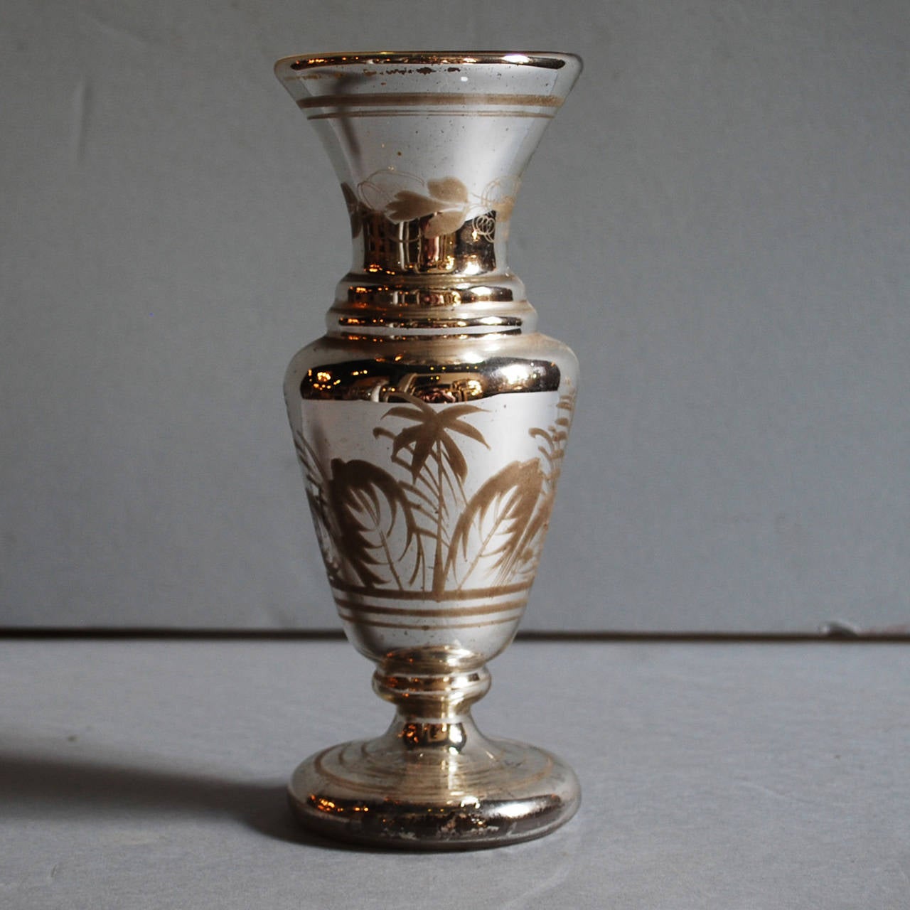 French mercury glass vase.
Made circa 1850 and still in a beautiful condition.
This glass was blown double walled, at the bottom you can see were the mold-blow pipe was attached.
Silvered 