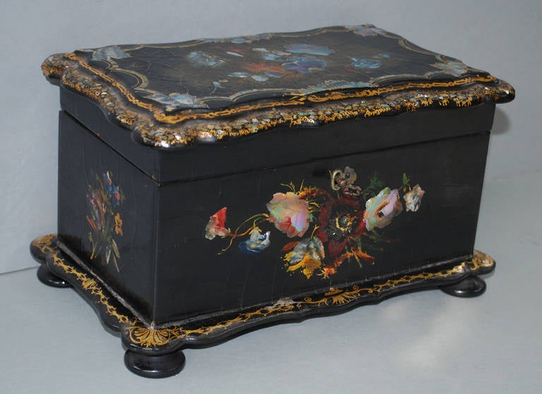 19th century hand-painted mother-of-pearl inlaid tea caddy with original mixing bowl.
Originates England, dating circa 1880.