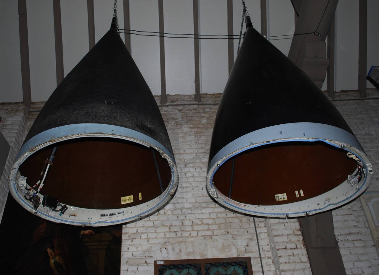 Unique objects. Very large industrial lamps. 
Original Panavia Tornado jet fighter heads are transformed into Industrial lighting.
Originates United Kingdom, dating 1982 & 1986.