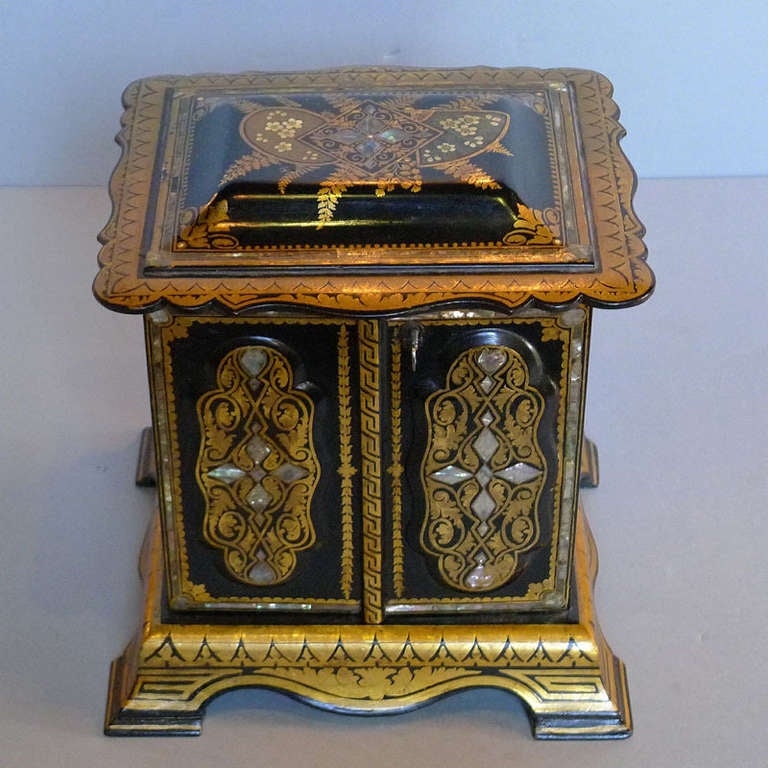 Beautiful piece of Italian craftsmanship. 
This jewelry box is hand painted, inlaid with copper and pearl shell. 
The box opens on the top and with 2 doors, behind these doors there are 4 drawers. 
Unique item!
Originates Venice, Italy, dating