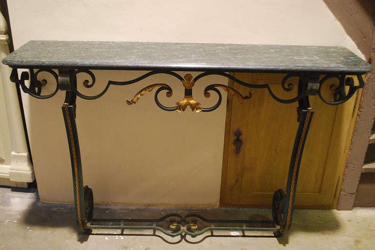20th century iron console table sideboard with serpentino marble top.
Originates France, dating circa 1930.