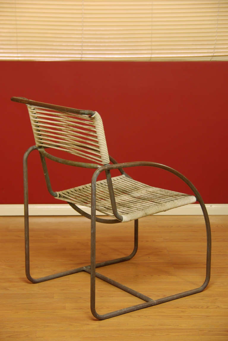 Vintage patio chairs designed by Kipp Stewart for Terra. Featuring tubular bronze frames with beautiful patina and original rush cord. 
