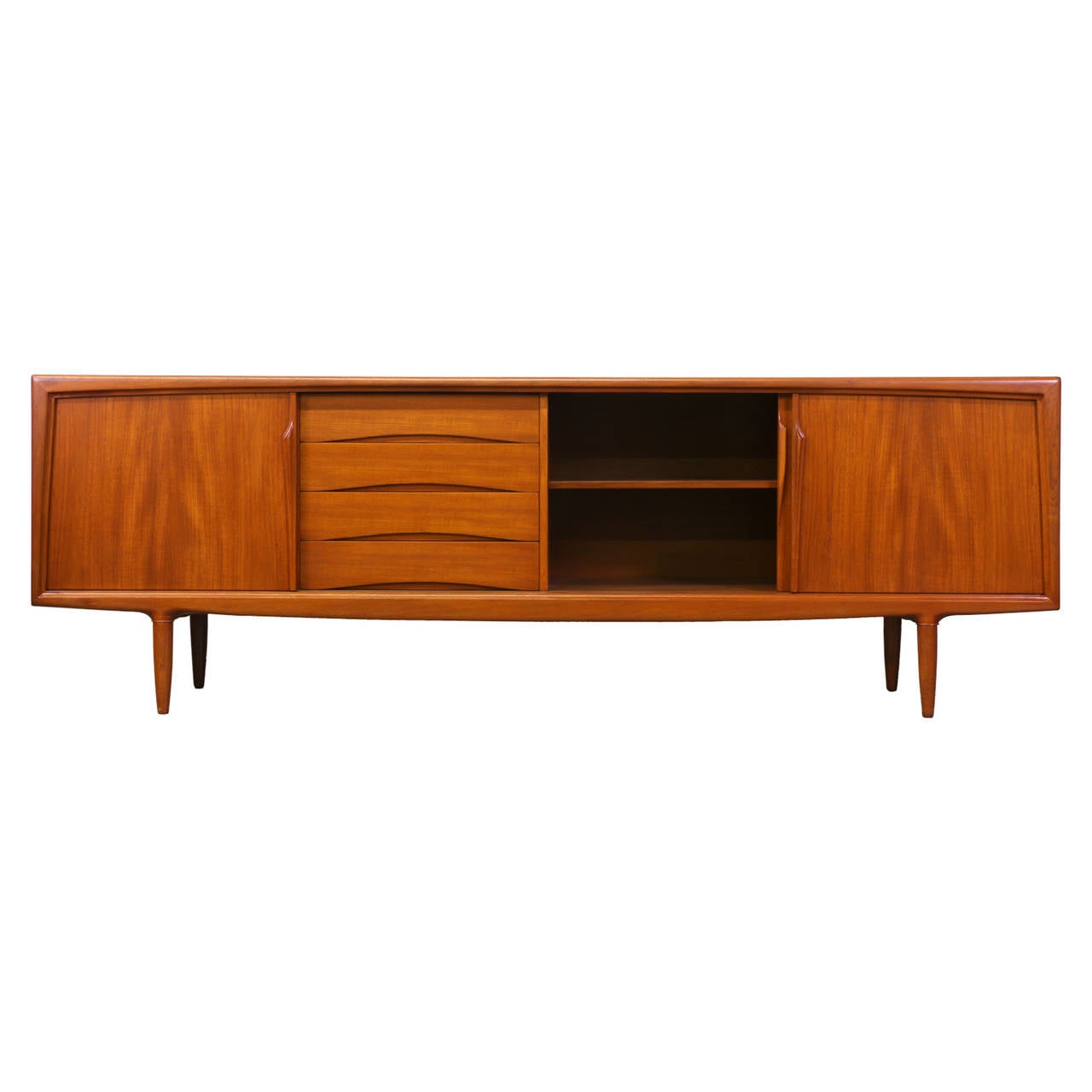 Designer: Gunni Omann.
Manufacturer: Axel Christiansen.
Period/Style: Danish Modern.
Country: Denmark.
Date: 1960s.

Dimensions: 31.5″ H x 94.5″ L x 17.5″ W.
Materials: Teak.
Condition: Excellent, newly refinished.
Number of items: One.
ID
