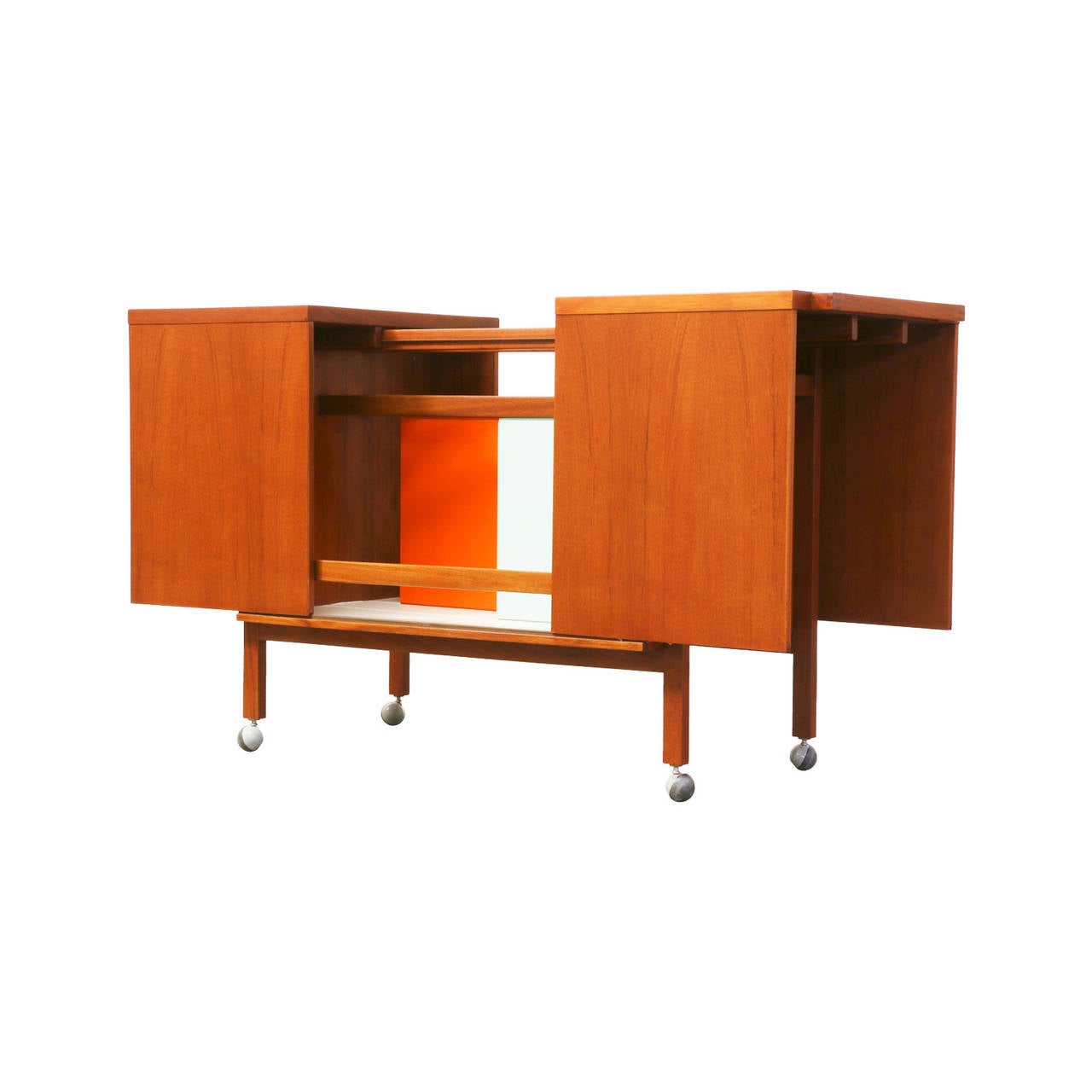 Designer: Niels Erik Glasdam Jensen.
Manufacturer: Vantinge Møbelindustri.
Period/Style: Danish Modern.
Country: Denmark.
Date: 1964.

Dimensions: 28″ H x 20″ W x 25″ L.
Materials: Teak, formica, glass.
Condition: Excellent newly