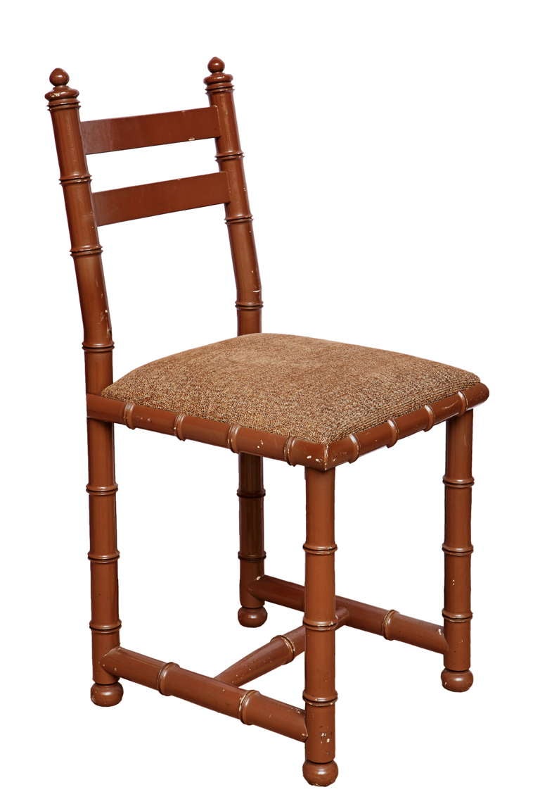 A french Brown painted faux bamboo dining suite by Maison Jansen