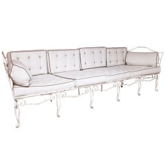 A french white-painted and wrought-iron sofa by Charles Moreux