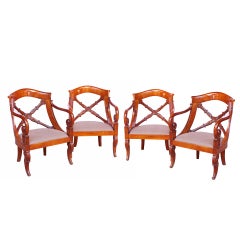 A set of four Charles X fruitwood fauteuils