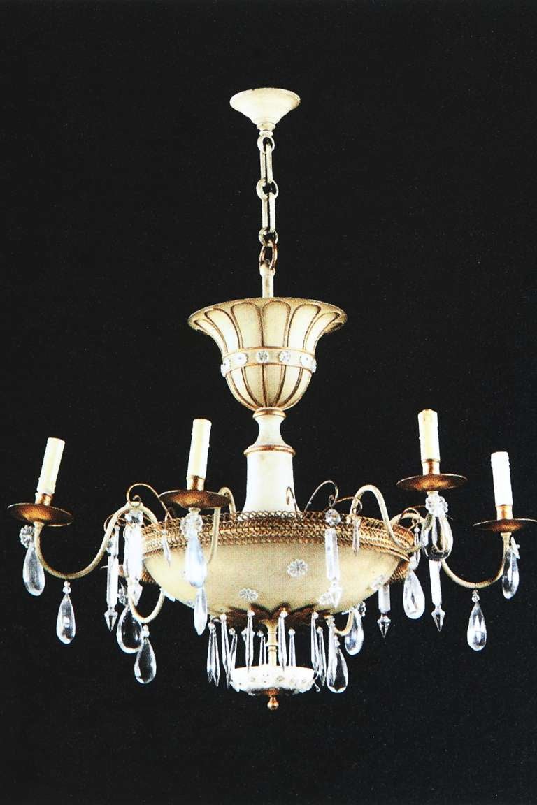A French parcel-gilt and white-painted six-light chandelier by Maison Baguès
