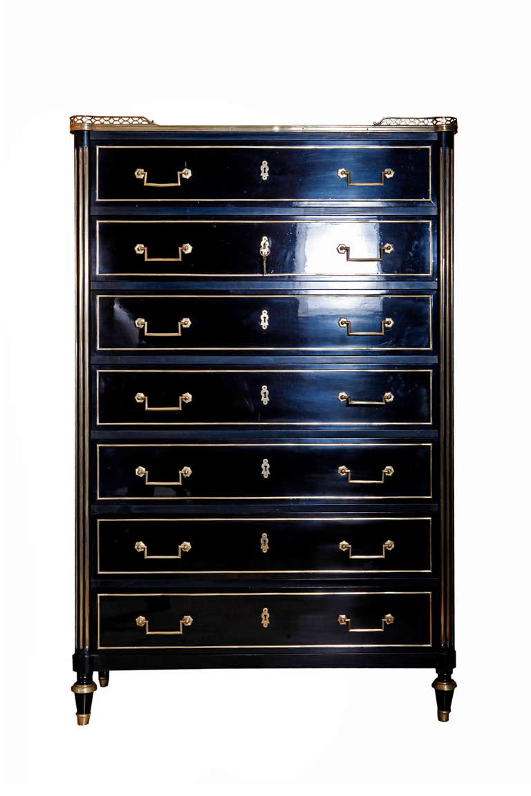 A french black lacquered and brass details Louis XVI style semanier.