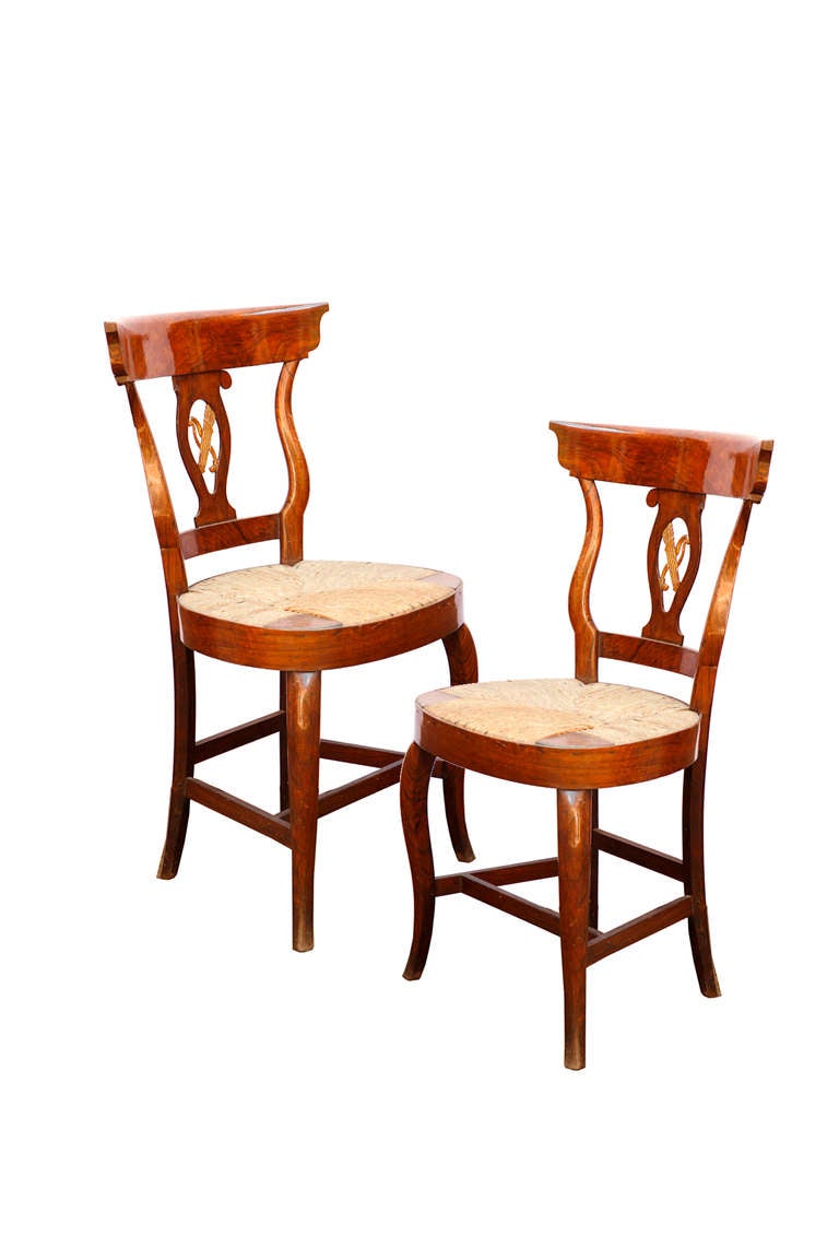 A pair of spanish parcel-gilt Walnut side chairs