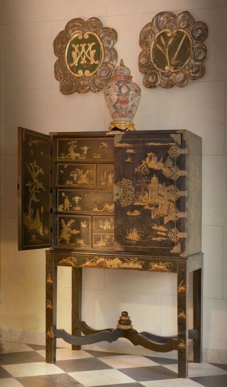 A Queen Anne Black and Gilt-Japanned Cabinet