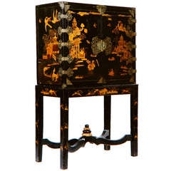 A Queen Anne Black and Gilt-Japanned Cabinet