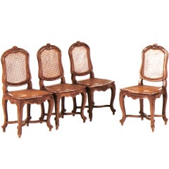 A Set of Four Louis XV Stained Fruitwood Side Chairs