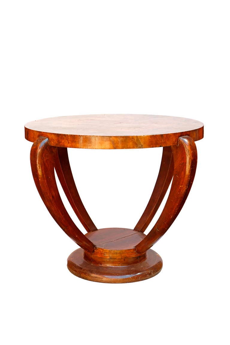 the circular top above four shaped legs on a moulded circular base.
A related model is illustrated in: Viviane Jutheau, Jules et André Leleu, Paris, 1989, p.60
A comparable table was sold at sotheby´s, New York, 28 March 2008, lot 175.