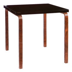 A Finnish Ebonised and Beenchwood Table by Alvar Aalto