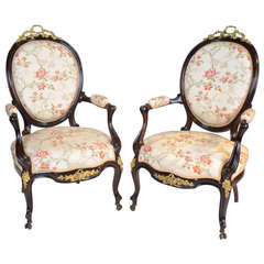 A Fine Pair Of French Salon Chairs In Rosewood With Cast Gilt Metal Mounts.
