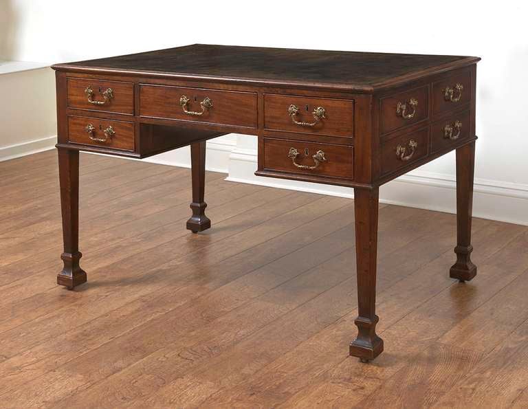 A superb and highly important library table in the manner of Thomas Chippendale. During the first decade of the reign of George III the newly fashionable taste for classical style artefacts can be best seen in the finest English furniture, circa