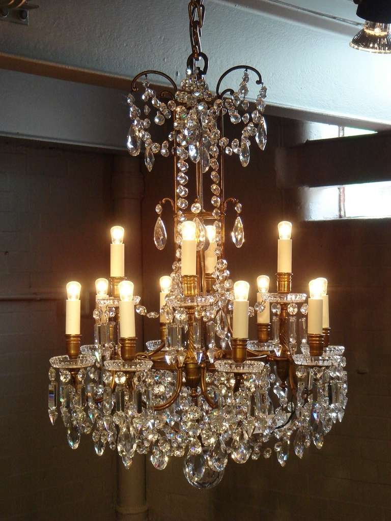 A wonderful twelve-light Baccarat crystal and gilt bronze chandelier.
The drip trays with Baccarat stamp.