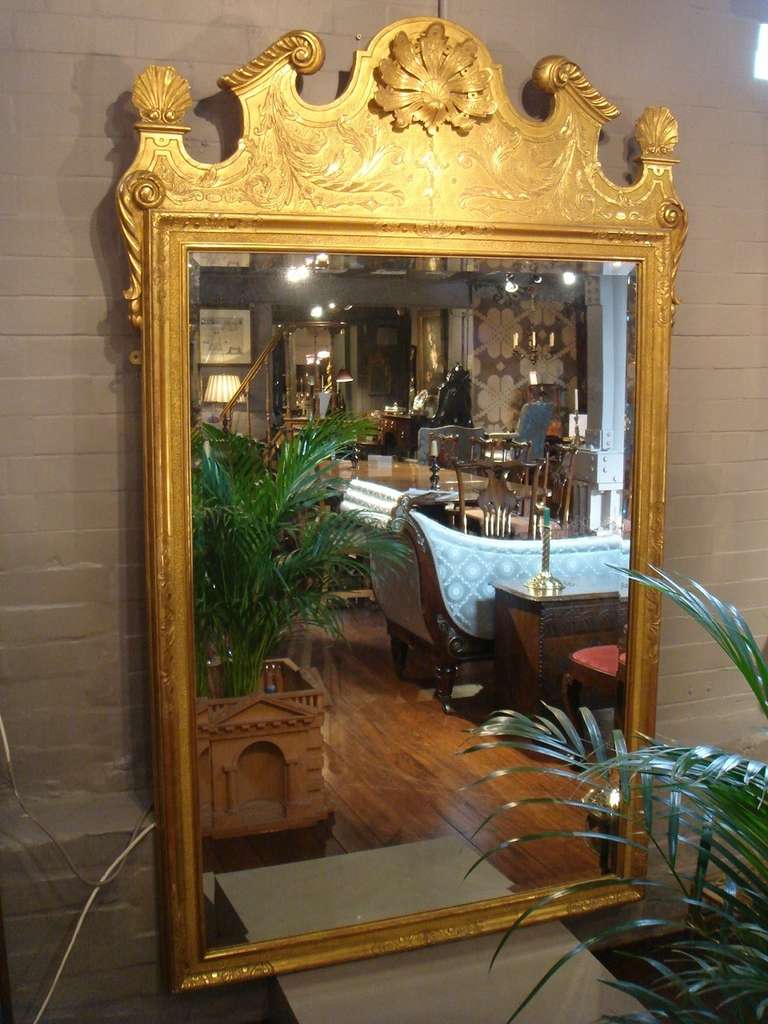 English A Large Pair of Carved and Giltwood Mirrors of Substantial Proportions