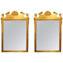 A Large Pair of Carved and Giltwood Mirrors of Substantial Proportions