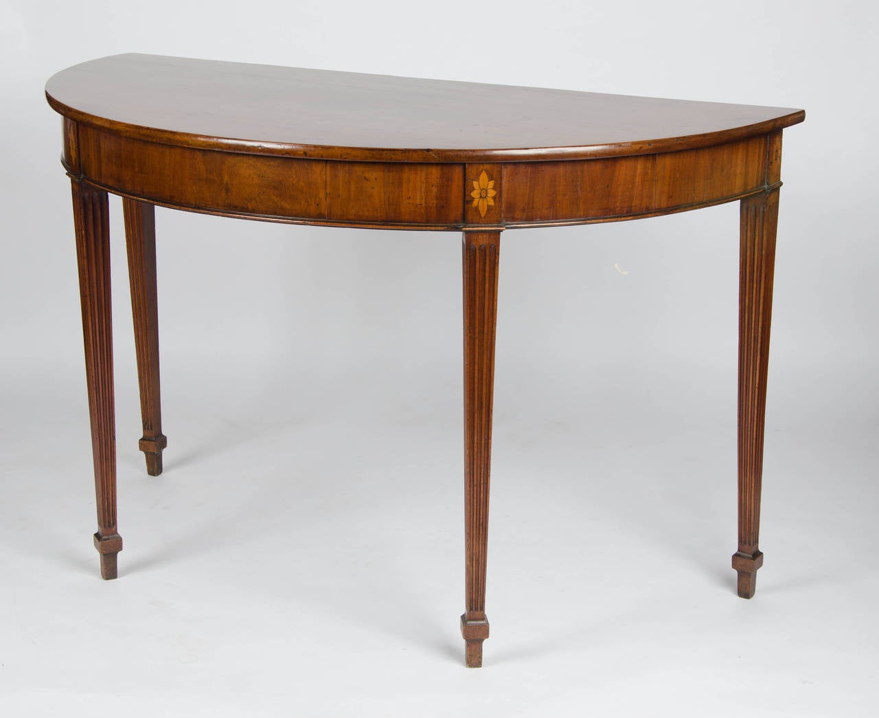 Mid-18th Century An 18th century mahogany demi-lune side, console or serving table.