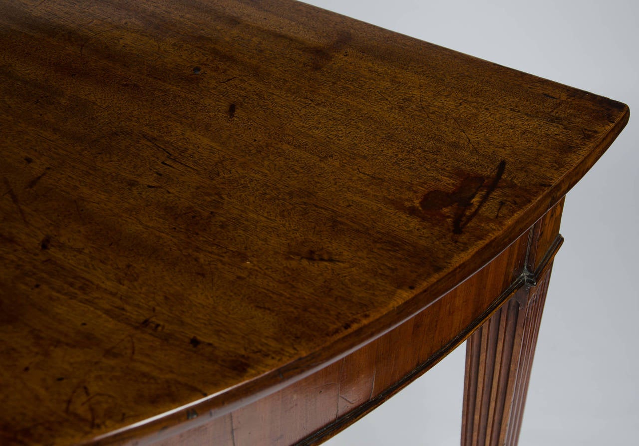 Mahogany An 18th century mahogany demi-lune side, console or serving table.