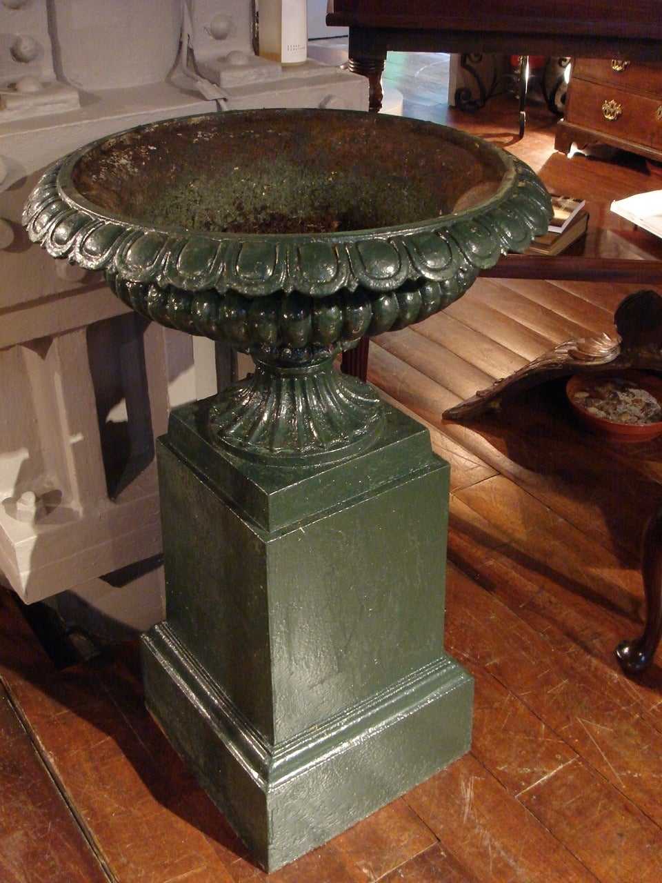 Of classical circular tazza form on square bases, painted a dark green.