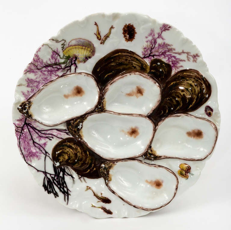 Beautiful and unique set of 6 Limoge Oyster plates, oyster shaped patterns.  Each plates are all hand painted.  Little different pattern from each other.  There are very minor chips on the edges of some plates.