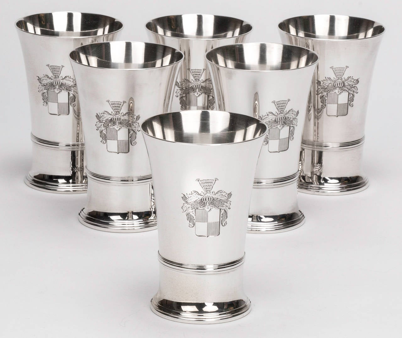 Magnificent set of six Tiffany sterling silver tumblers. Ring trim. Engraved crest on the side. 18998 Tiffany & Co makers 925 mark underneath. Great size holding up to 12oz. Per cup. In excellent condition.