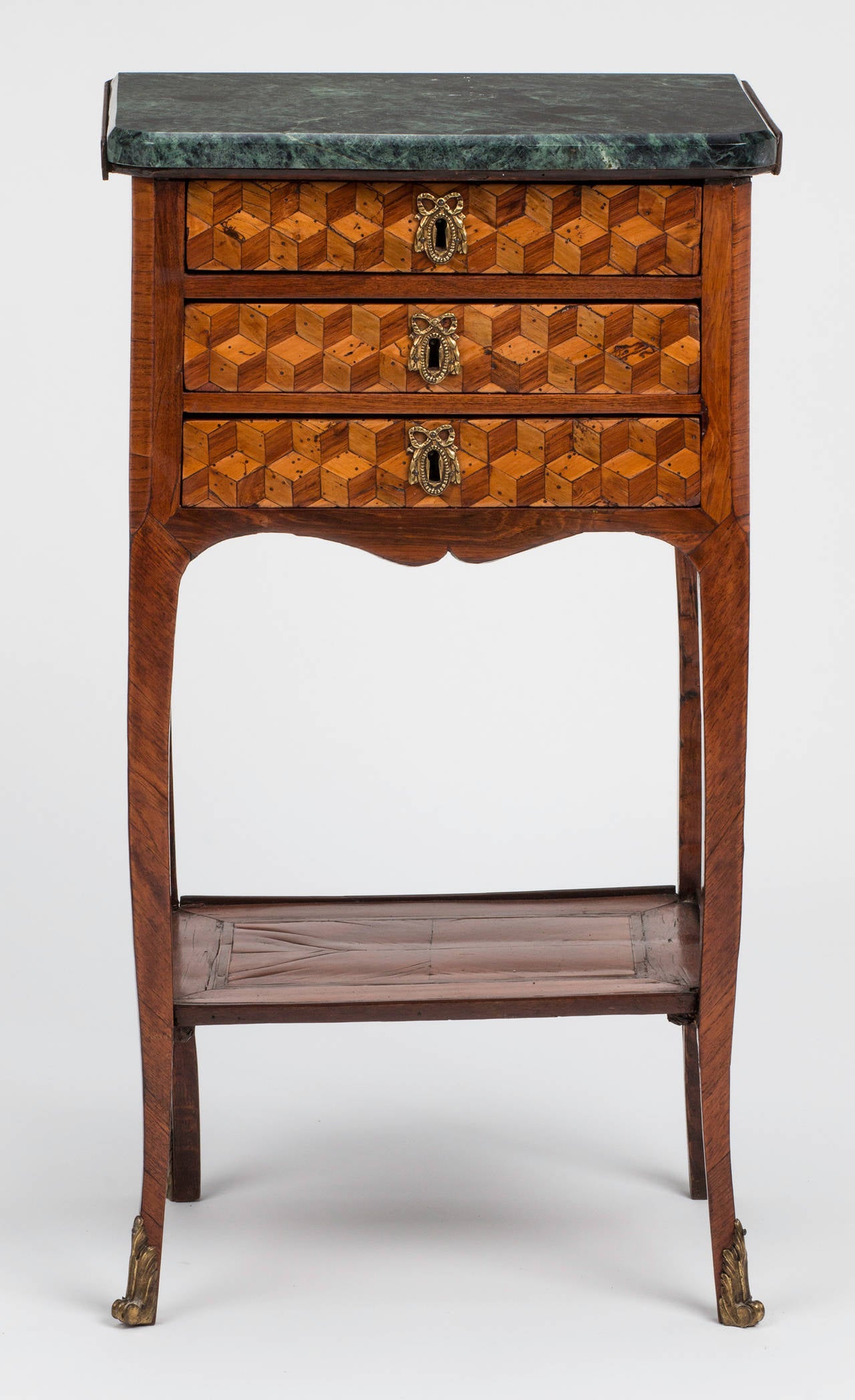 Beautiful marquetry table with three drawers. Original verdegris marble top, original bronze doré ormolu mounts and eschochons, circa 1750.