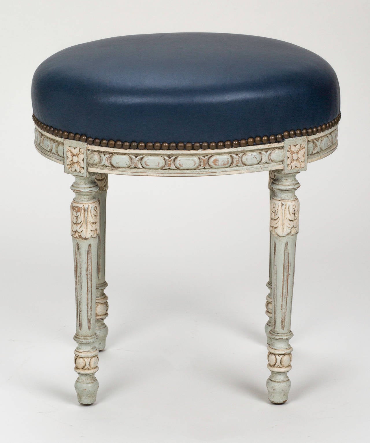 Louis XVI style wood frame in antique painted finish, French, circa 1880s. Newly upholstered in Edelman's leather. Handy footstool or bench.