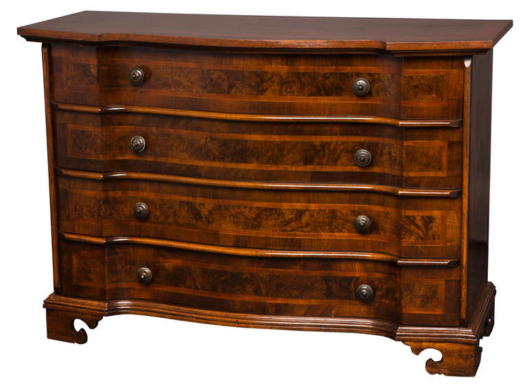 Vintage 1980s Beautiful walnut burl chest of drawers. Original antique brass knobs.  Handsome and practical use.  Large four drawers.  Serpentine front with contrasting liner on the burl veneer.  Nicely detailed with cut out feet.   Excellent