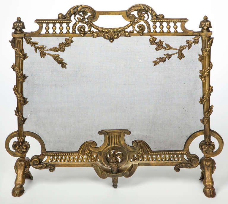 Exceptional Antique brass French fire screen.  Beautiful combinations of flowers intwined around flame torches standing on hoof feet.  
Shipping included within the Continental USA.