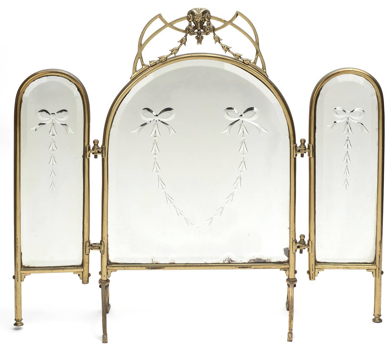 Lovely brass framed three way vanity mirrors.  Each mirrors beveled and  etched in swag garland design.  Some discoloration at the lower edge of the original mirror glass.