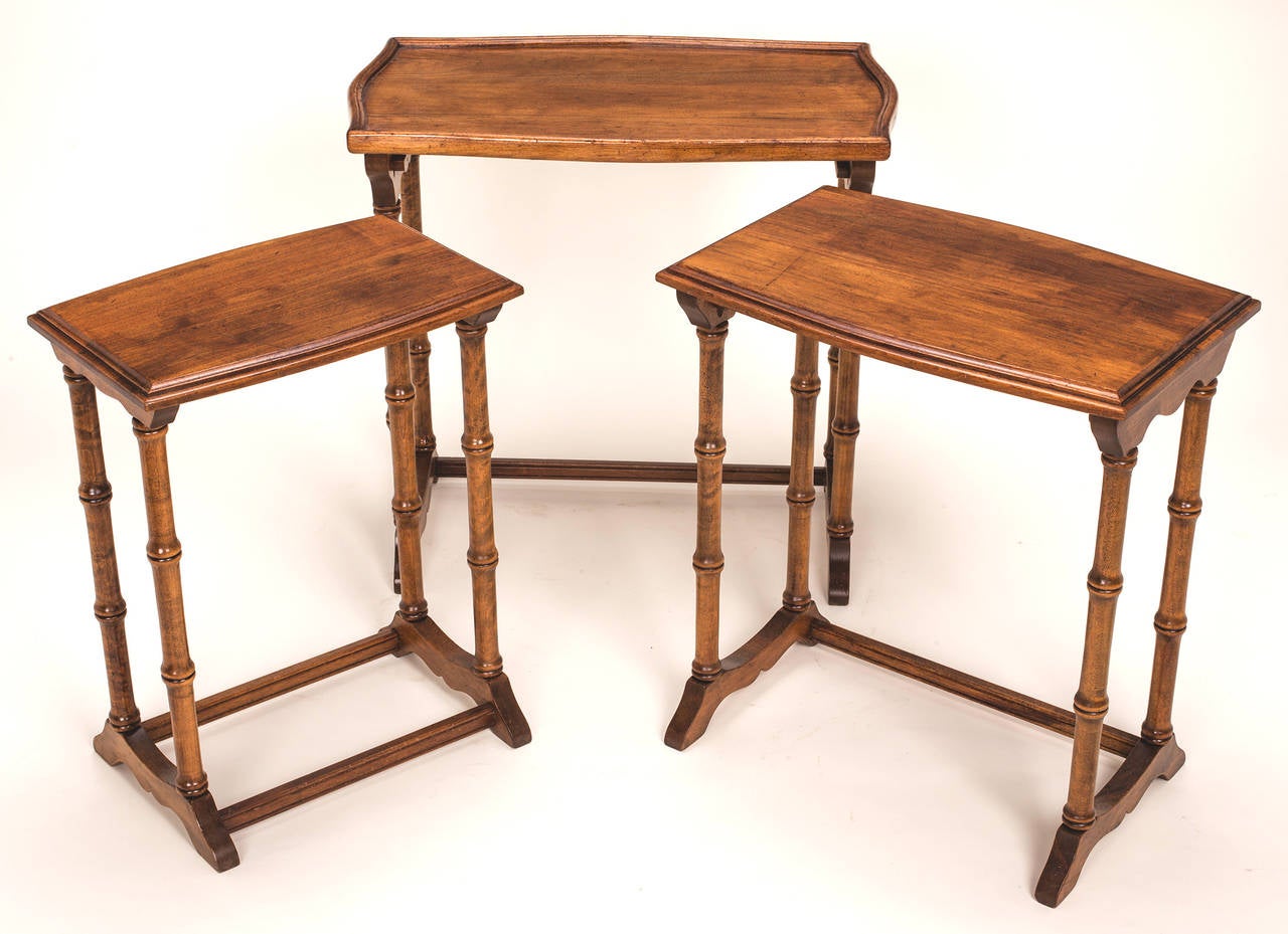 Lovely set of Three, nesting tables with faux bamboo legs.
 Dimensions:  Large table ia 15.5 D x 25 W x 23.5 H.  Medium table is 13.625 D x 19.75 W x 22 H.  Small table is 11 D x 16.5 W x 21.25 H.