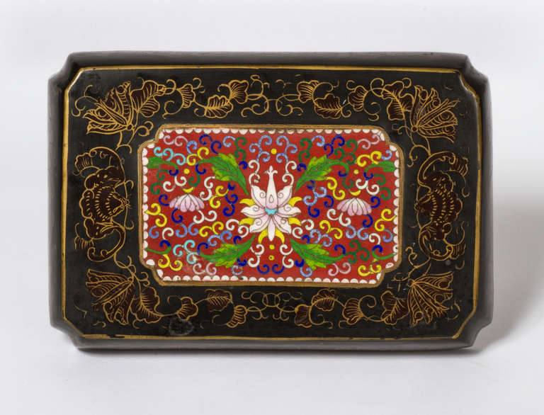 Early 1900s Exquisite Chinese lacquer box.  Fine cloisonné workmanship in a colorful floral design.  Red,  green and yellow enamel work is quite striking.  The lacquer box is also painted in gilt filigree with bats and leaves.   It is doubly