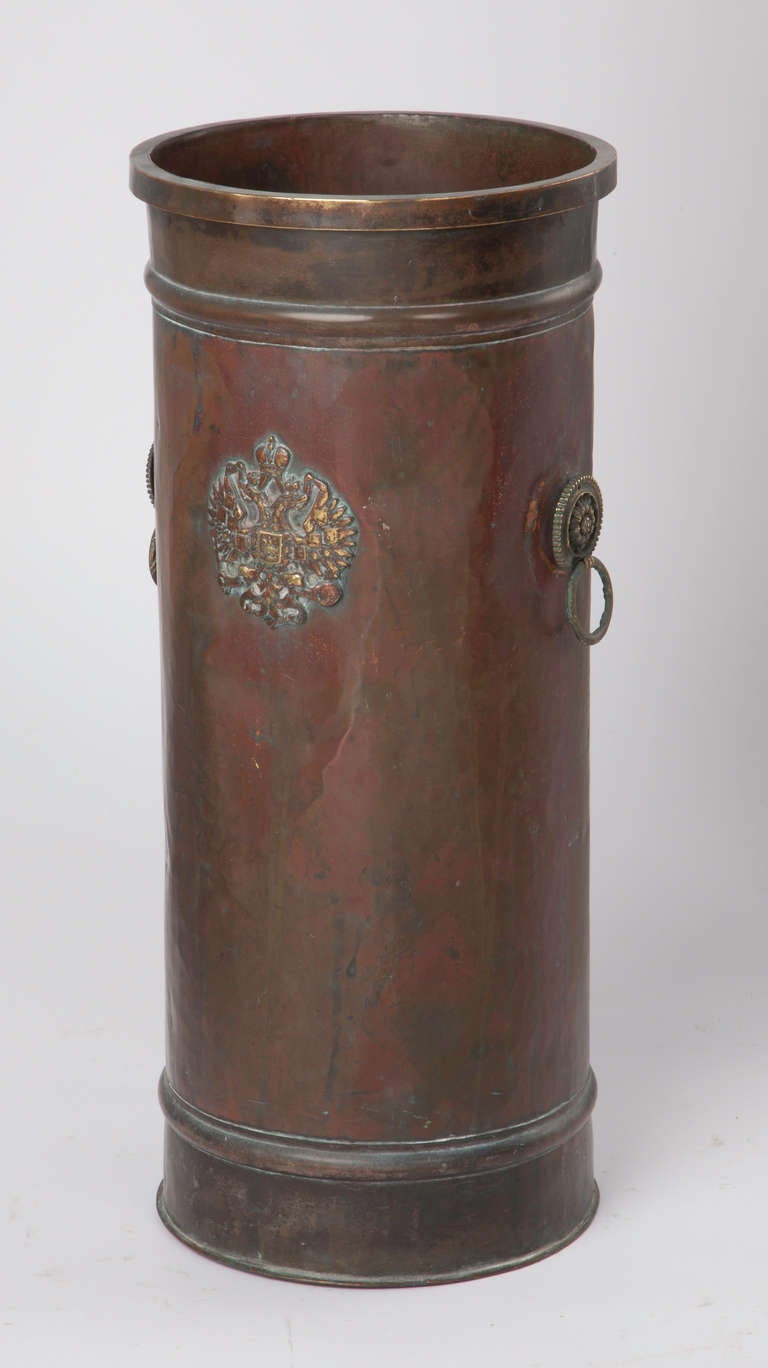 C. 1930s.  Wonderfully aged copper umbrella stand with Double Eagle Russian emblem in brass.   Small handles on each sides.  Shipping included.  Cont. US