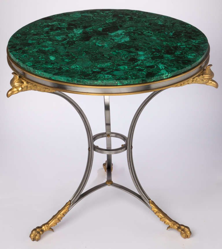 C. 1930s. Exquisite round Russian malachite circular top.  The table base is  made in Italy in sleek polished steel and bronze dore' of eagle heads and feet of eagle claws.  Very dramatic accent piece!
Shipping included to Cont. US.