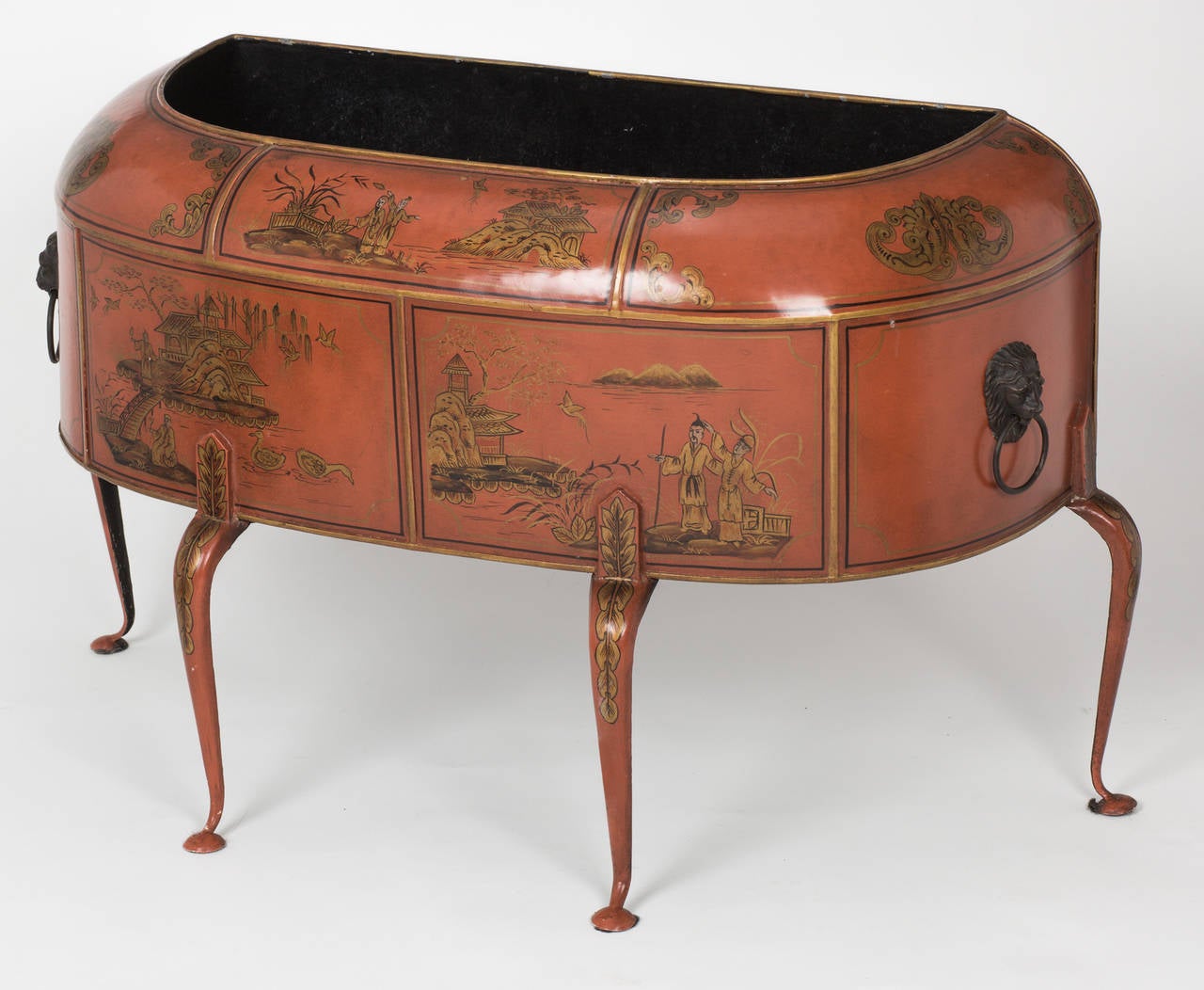 Charming tole, painted  metal  Chioiserie style planter.  Half round bombe  front is supported with four graceful legs. Lion face ring handles on each sides.