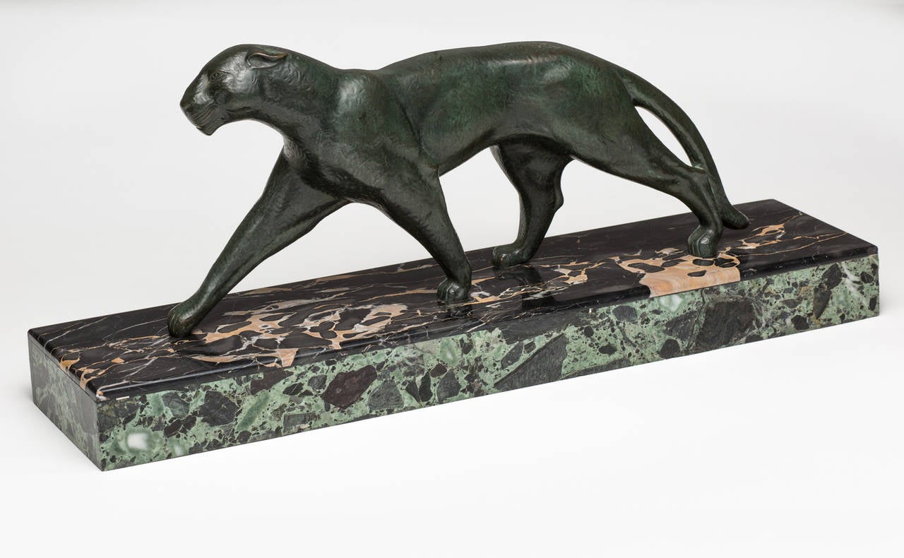 Bronze panther on a beautiful marble base, signed Michel Decoux, circa 1920s.
The artist has signed both the base and the inside left thigh of the figure.
Small chip on the marble base