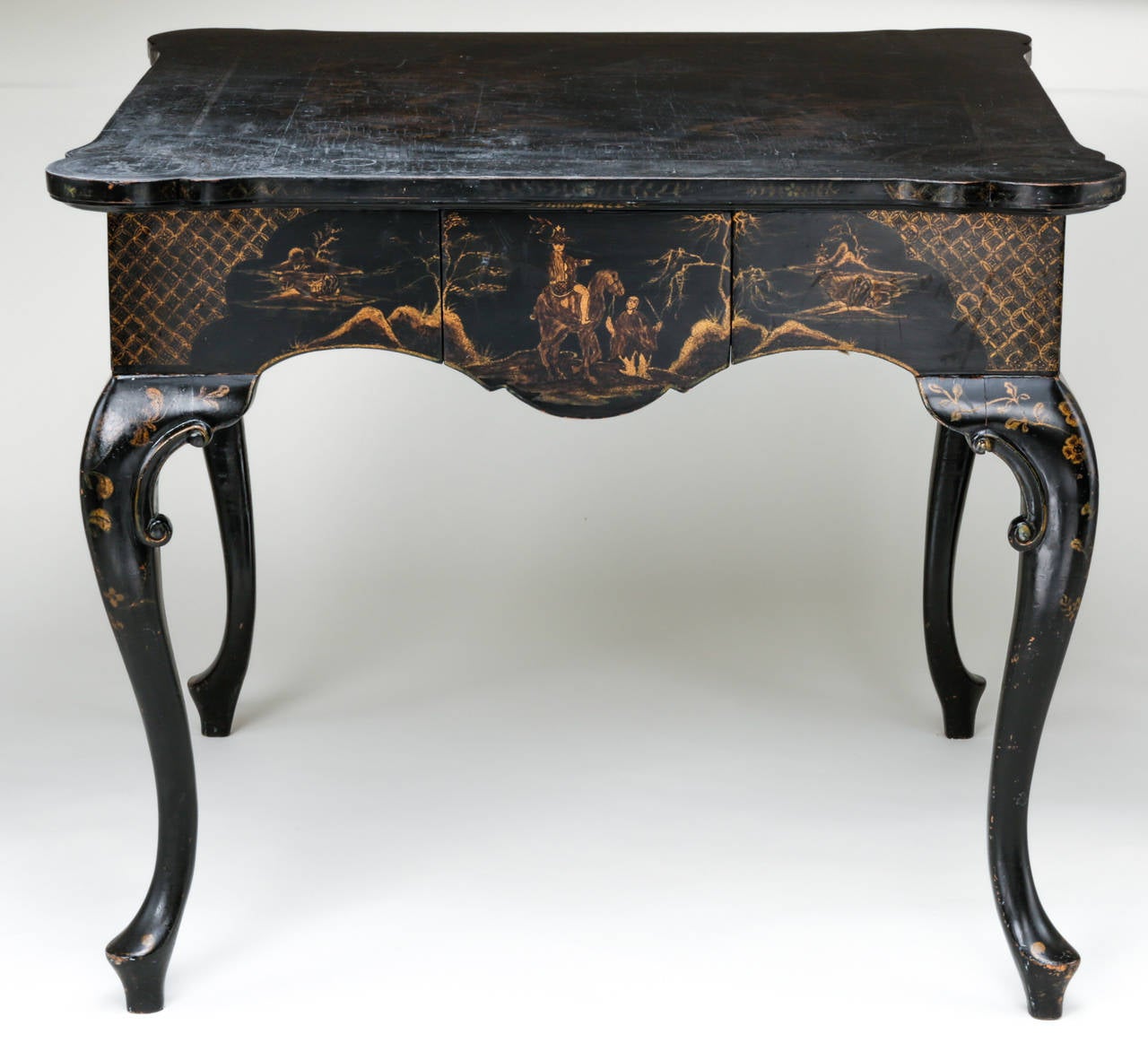C.1940s Black lacquer chinoiserie game tables.  Graceful cabriole legs with continuous decorative chinoiserie painting on the apron front with drawer.  There are Drawers are on all four sides.  Please see photos for Cracks on lacquer finish on the