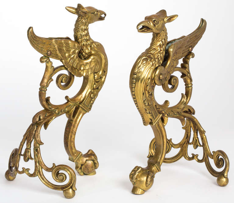 19th c. Antique brass pair of andirons.  Beautifully cast and detailed.  Griffins are mythological bird-like figures.  Decorative and dramatic on mantles or fireplace.  Shipping included to Continental US.