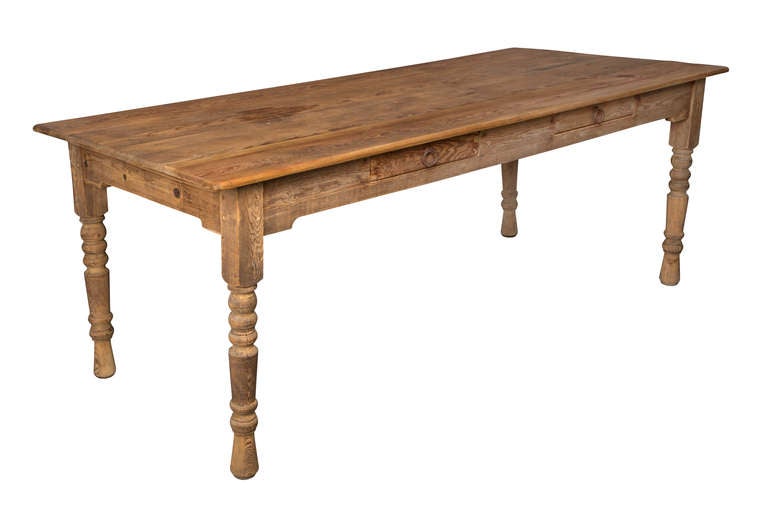 Simply hand made rustic pine table.  Turned legs, plank top with two drawers.
Great for dining table or large work desk.  Shipping included to Continental US.