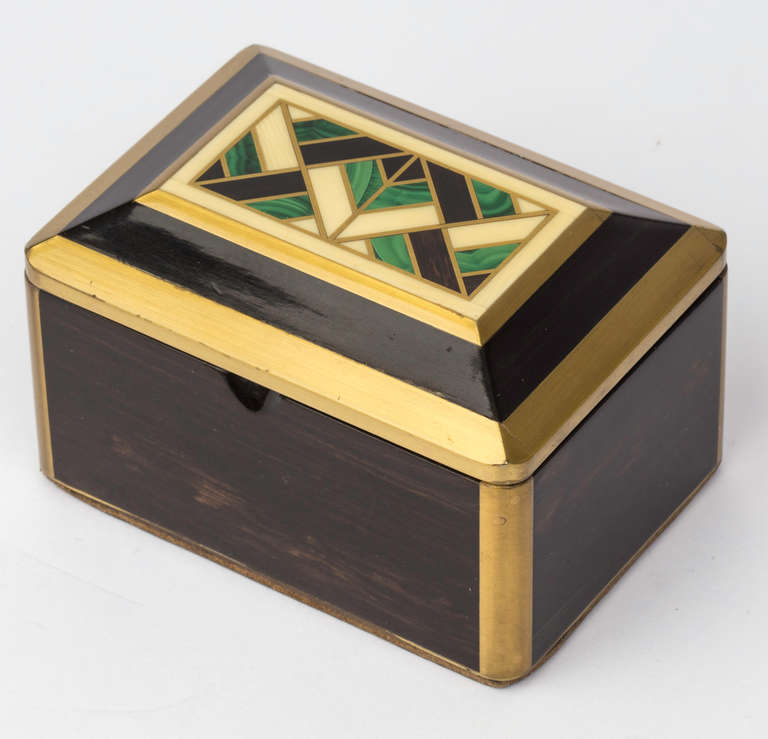 Small exquisite Deco box.  Graduated lid with Inlay of wood, malachite, bone and brass.  Interior lined with felt.