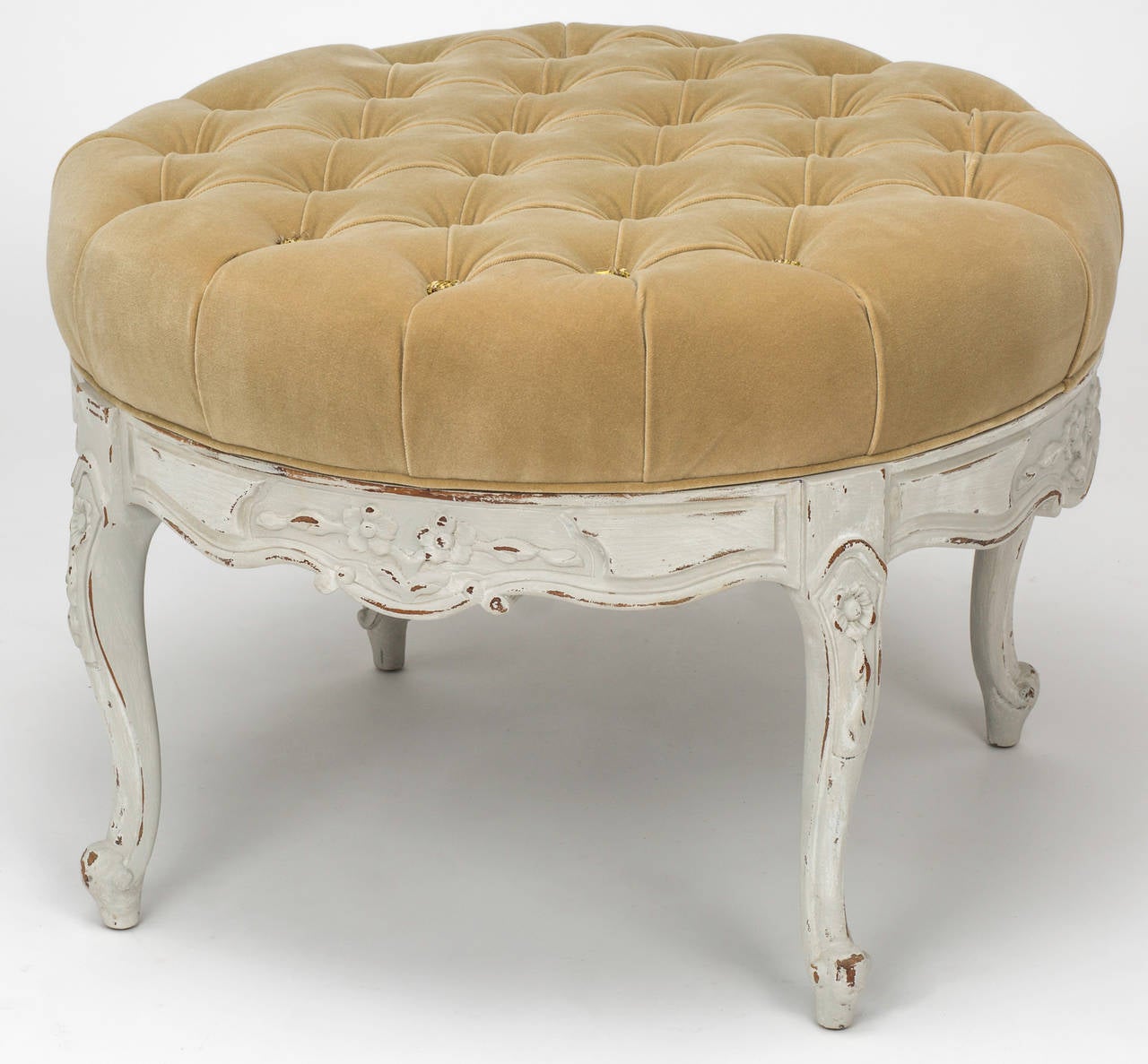 Round country French frame from the 1920s.  Beautifully  carved with antique white painted finish.  Newly upholstered in linen fabric with tufted top. Amply sized and comfortable.
