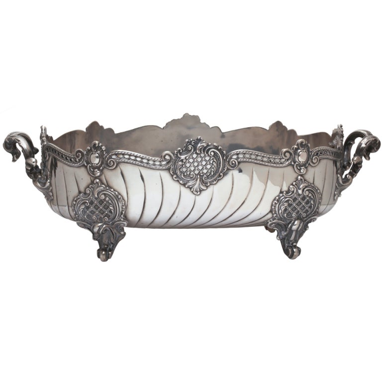 Very dramatic and beautiful German marked 800 silver center piece.  Handles on each ends.  Liner comes out protecting the silver from water build up damage.  Silver weight without the  liner 51.2 oz.