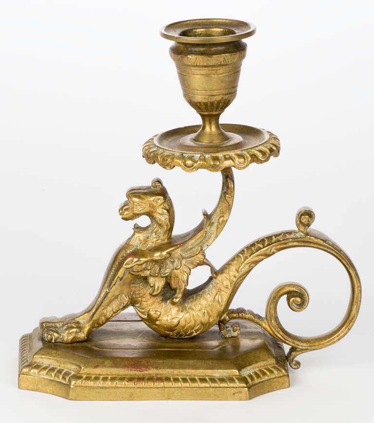 1930s unusual antique brass griffin candleholder. Graceful tail for handling.