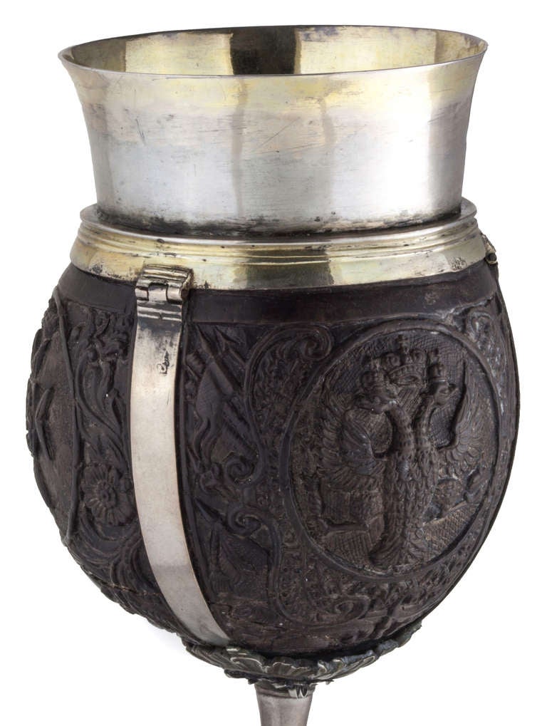 Moscow c.1747.  Exhibiting workmanship of the finest quality, this delightful drinking vessel combines beautifully wrought silver work with a masterfully carved coconut shell, creating an object that would have been prized in upper class circles for