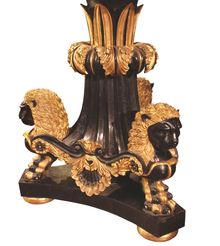 Fine Italian workmanship intricately detailed design on this beautiful tabletop. Stone marquetry inlay work from various semi-precious stones.
Base is dramatic gilt lions of ebonized wood,
circa 1940s. A stunning center table.